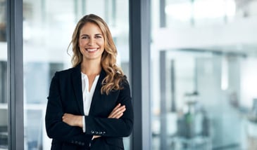 a confident woman smiling confidently