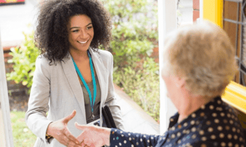 door to door sales woman shaking hands with a customer