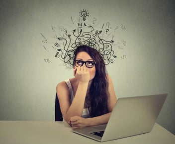 woman-with-thoughtful-expression-sitting